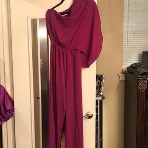 Magenta jumpsuit small one side is off the shoulder never worn 100 polyester
